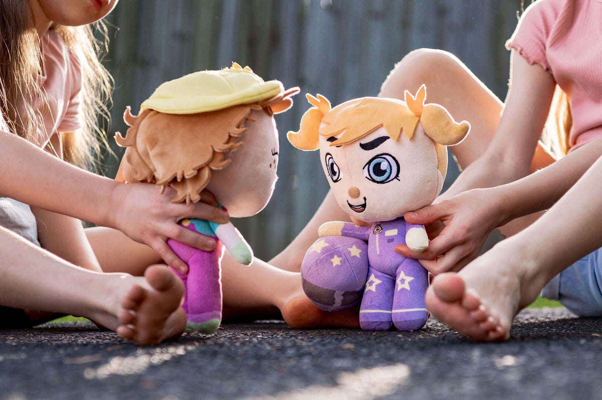 Child playing with Rosie Racer doll outdoors - encouraging kids to try new and challenging things