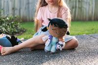 Child playing with Venus Vet plush in outdoor setting