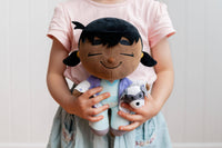 Child playing with Venus Vet plush in indoor setting