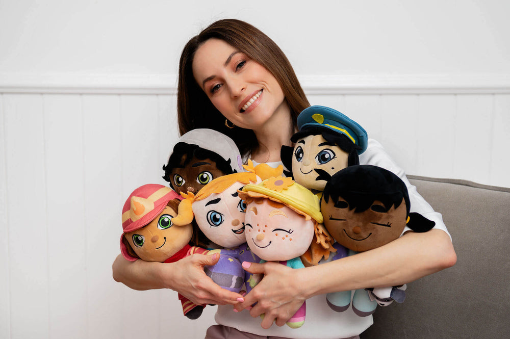 Jana Black holds plush dolls that inspire girls to dream