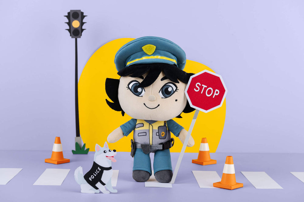 Pippa Police Officer plush doll in a styled paper-crafted scene.