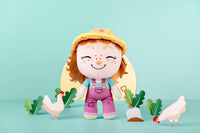 Gloria Gardener plush with chickens wearing a yellow hat, purple overalls, and a green shirt.