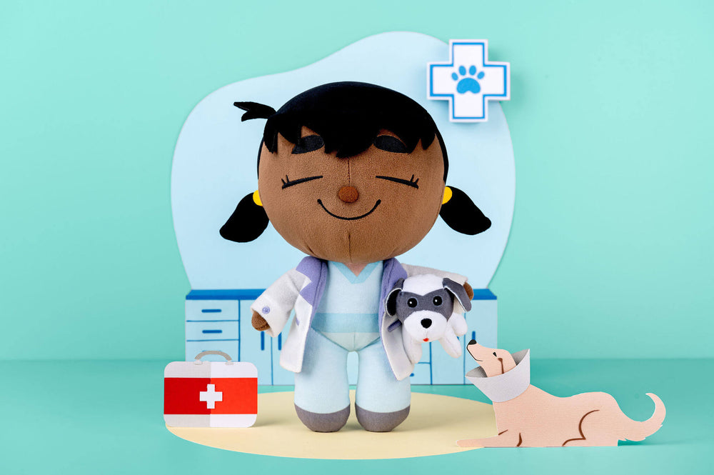 Venus Vet plush doll in a styled paper-crafted scene.