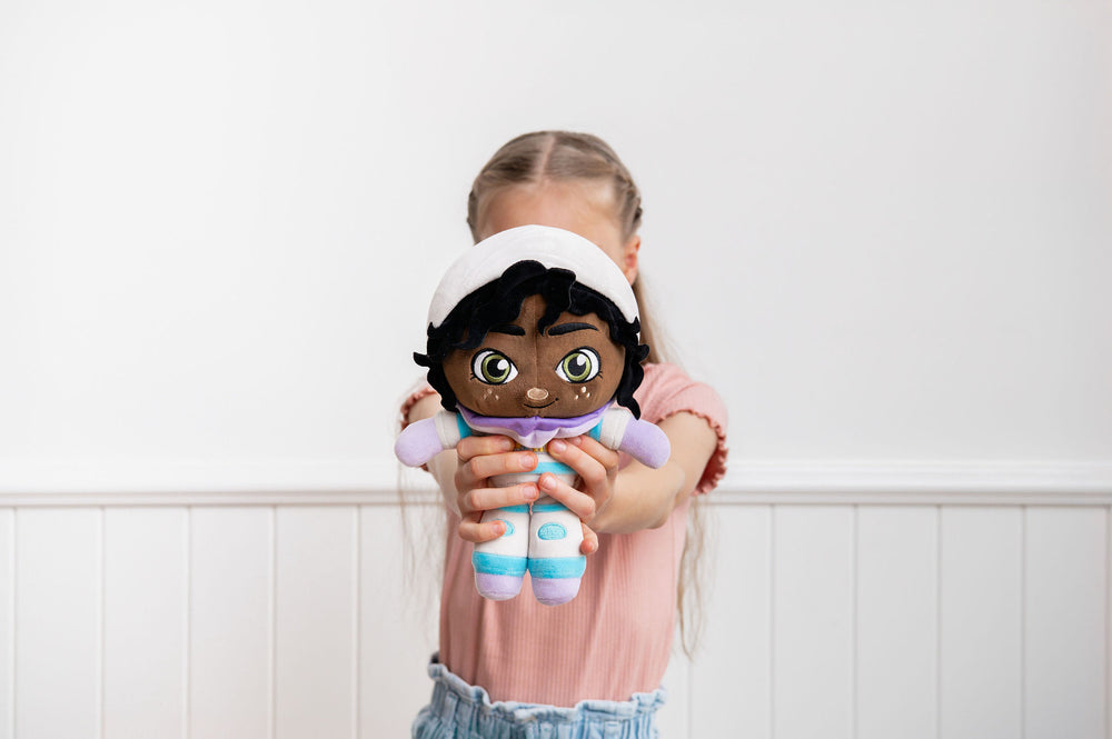 Child playing with Aria Astronaut doll indoors - space exploration and science learning toy